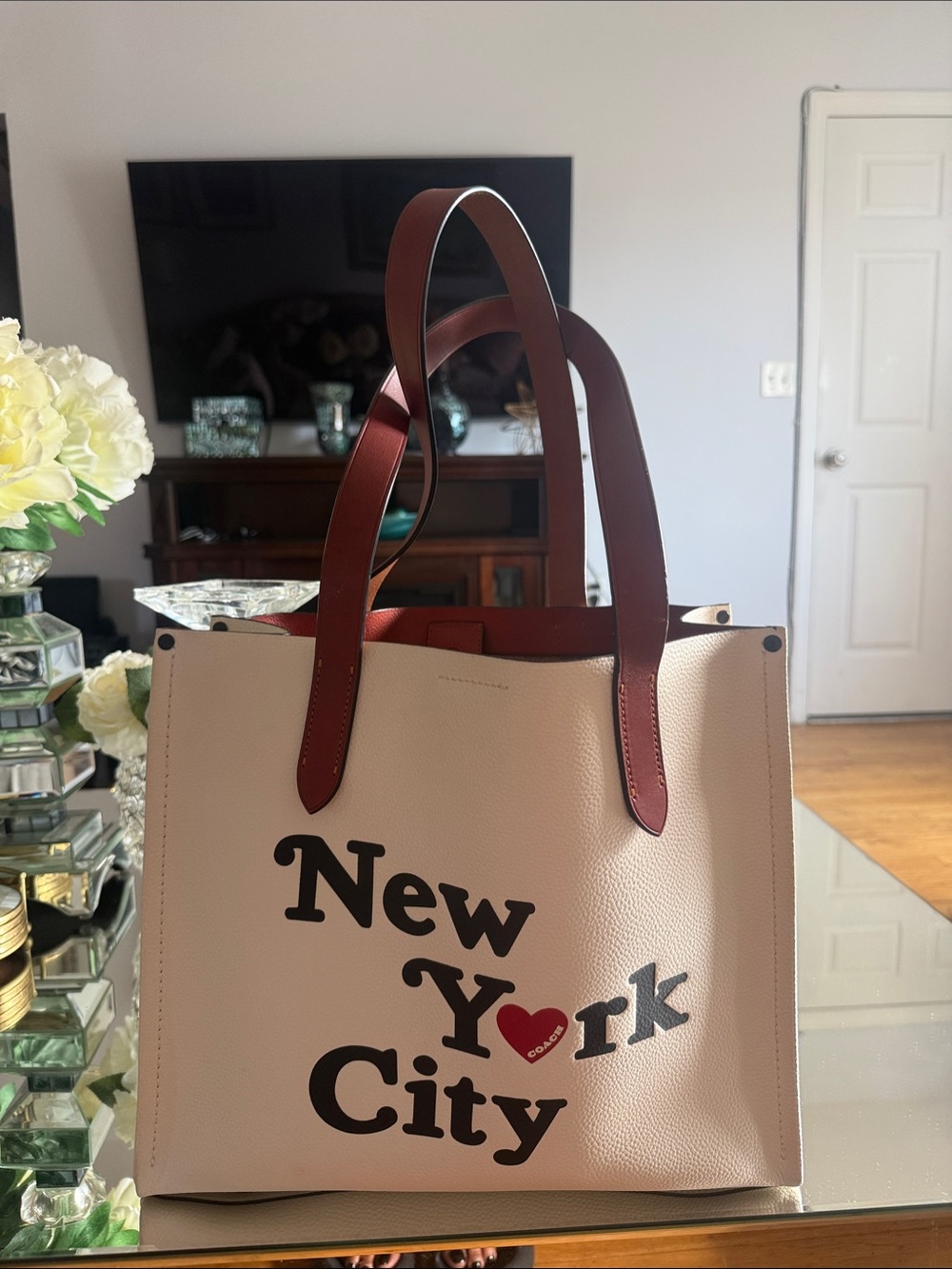 Coach Cream Tote with Brown Handles and Black Graphic